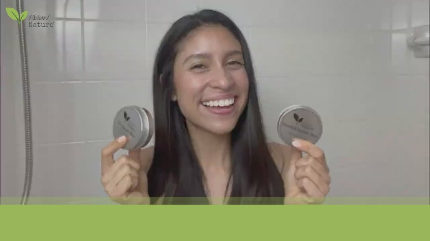 Woman in Bathroom showing how to use liv Nature travel shampoo and conditioner set